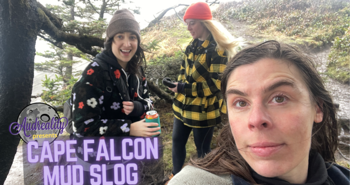 Three happy women are bundled up on a chilly, windy day at the coast.